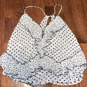 A blue and white polka dot tank